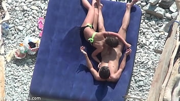 Couple having sex on the beach.