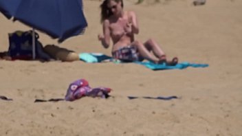 German lady topless at the beach