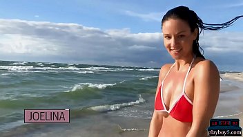 German MILF model Joelina strips naked on the beach