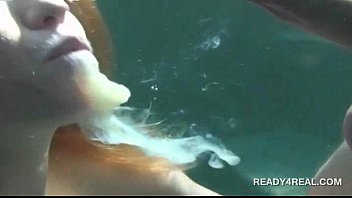 Redhead hottie eats cock underwater for cash