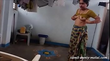 Chennai Triplicane Tamil 36 yrs old married beautiful, gorgeous and hot Brahmin housewife aunty Mrs. Alamelu Krishnamoorthy showing her nice boobs, while she wearing dress at hall room super hit viral porn video # 23.07.2016.