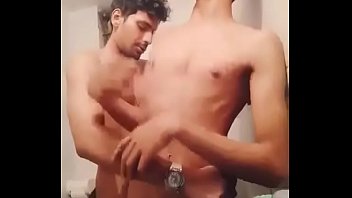 Cute indian gay twinks having foreplay in washroom