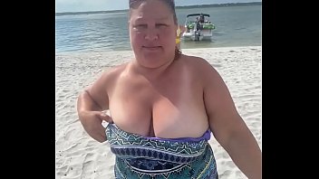 Slutty Bbw duca wife flashes her big tits on a public beach
